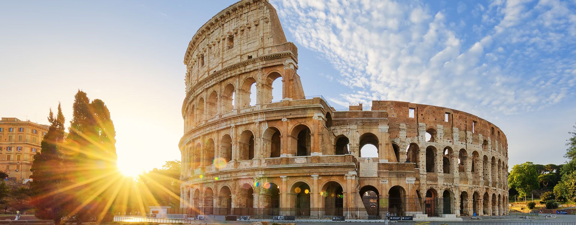 View of Colosseum in Rome and morning sun, Italy, Europe.