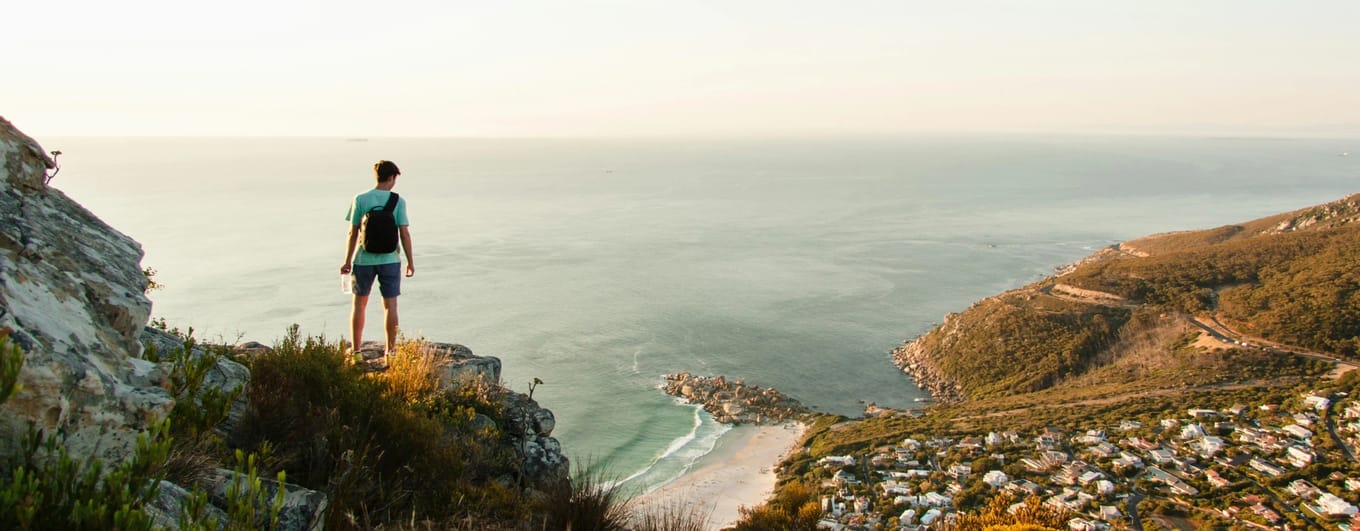 Man standing overlooking bay in South Africa