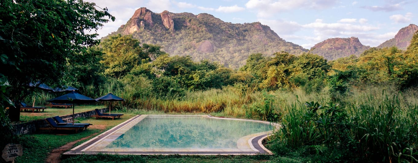 Swimming pool and mountains at Gal Oya Lodge