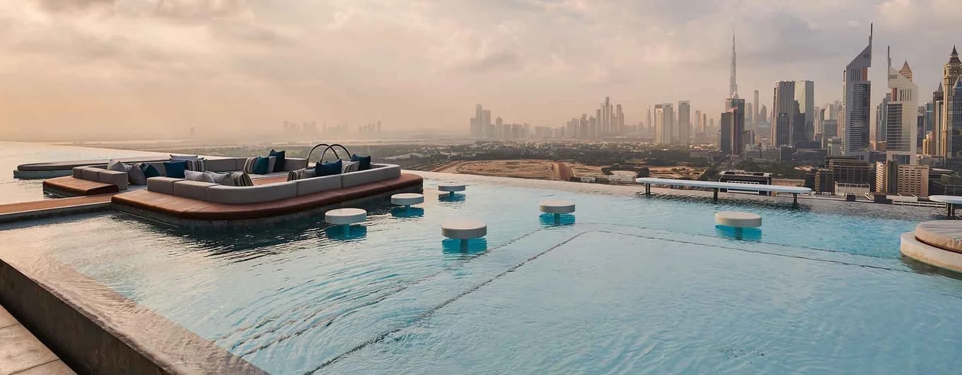 Rooftop swimming pool and view of Dubai skyline