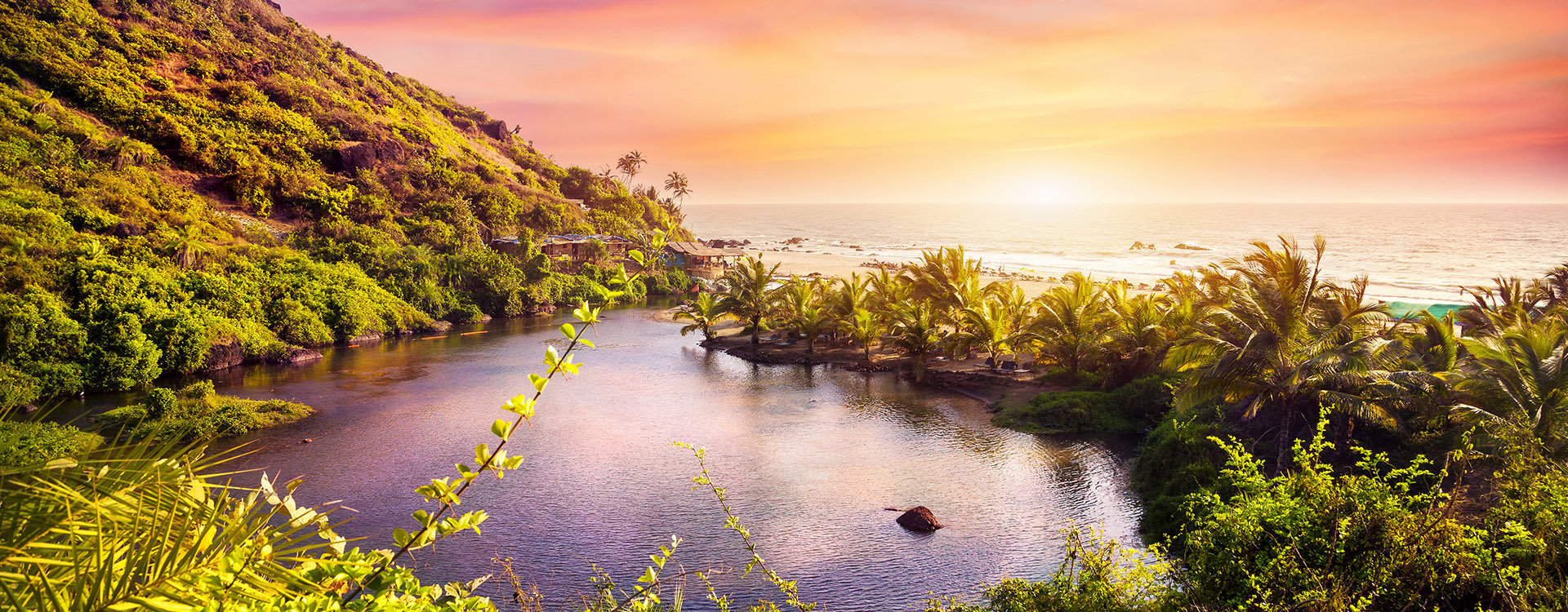 Tropical view to the Sweet Lake on Arambol beach at purple sky in Goa, India