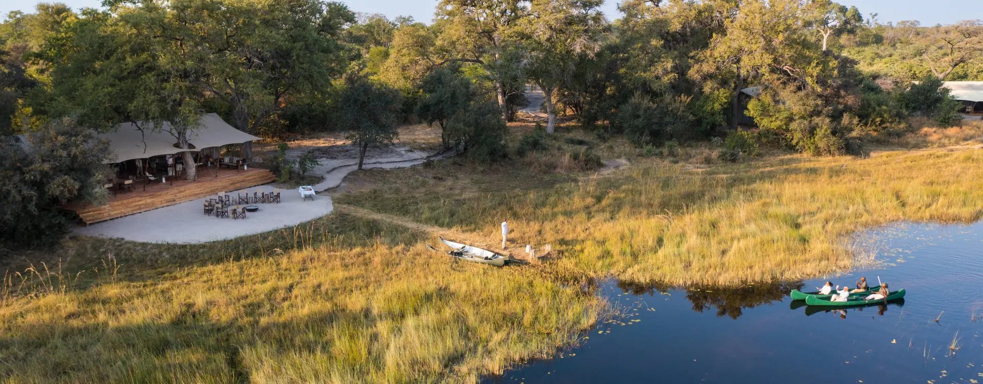 Aerial view of luxury camp on edge of river in Africa