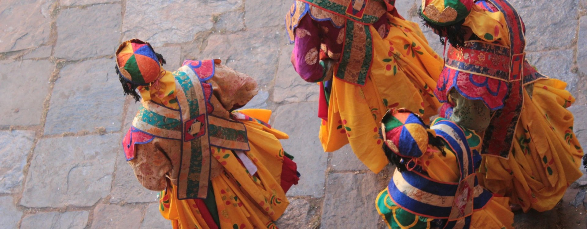 Aerial image of men in Bhutanese traditional dress