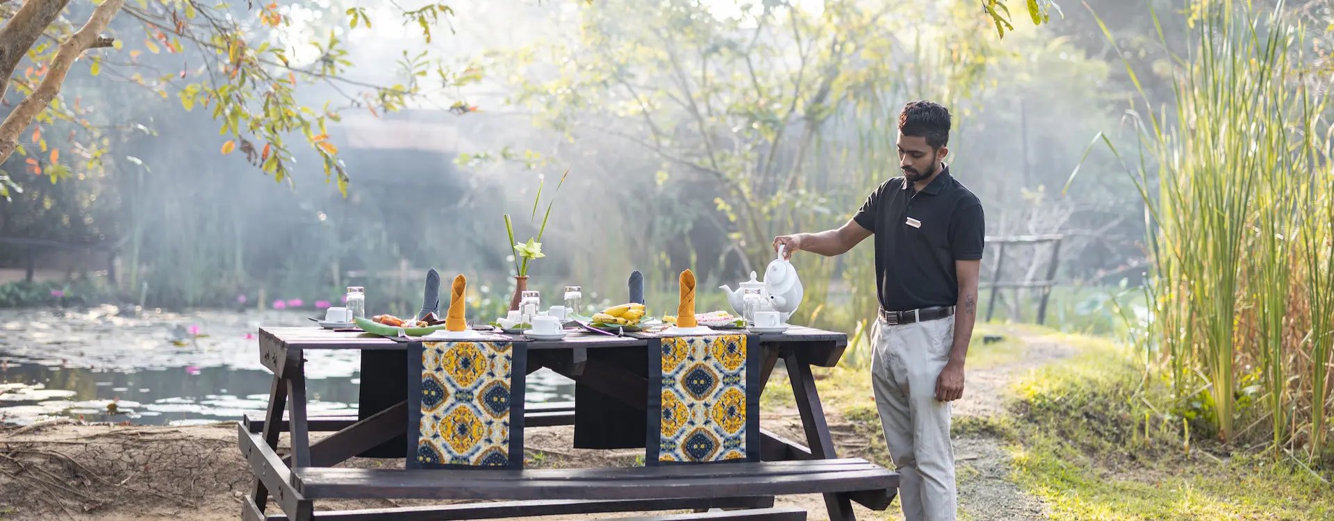 Man serving breakfast outside in Sri Lanka