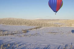 Hot Air Ballooning in Winter by The Outpost Lodge, Finland