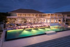 Nightime view of the hotel and main swimming pool