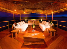 lounge area at nightime onboard luxury small amazon cruise ship