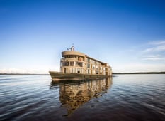 exterior of small luxury delfin cruise ship on amazon river