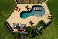 Aerial view of swimming pool with loungers