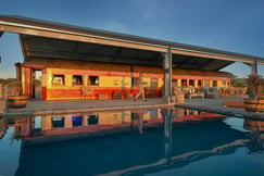 Main lodge with outside terrace and swimming pool