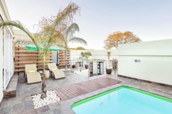 Outdoor terrace with swimming pool and sunloungers