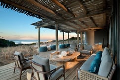 Outdoor terrace with chairs and ocean views