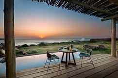 Sunset over the ocean by private pool