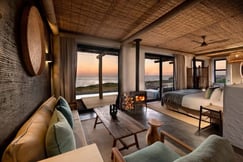 Suite at GweGwe with bed and lounge area and ocean views