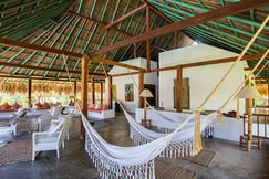 Lobby area with hammocks at Villa Playa Colombia