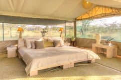 Bedroom at luxury Kenya hotel with white interior