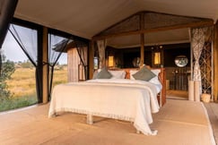 Double bed with surrounding bush views at Kimya Kimya