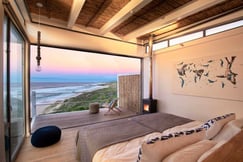 Sunset views from bedroom at Lekkerwater Beach Lodge