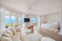 Hotel suite with tv and ocean views