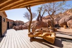 Outside terrace with granite boulders and trees