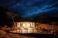 Open air double bedroom under starlit skies