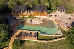 Aerial shot of swimming pool at luxury camp in Tanzania