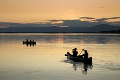 Sunset canoeing in the river