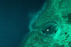 Aeriel view of the Manta Resort and surrounding coral sea near Pemba Island