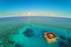 Aerial view of the Underwater suite and the surrounding coral reef at The Manta Resort at Pemba Island