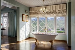 Freestanding bath with views of the surrounding tea estates at Uga Halloowella