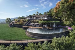 Infinity pool and main house with surrounding gardens at Uga Halloowella