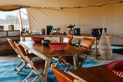 Dining table and chairs at the mobile tented camp Usawa Serengeti