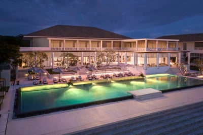 Nightime view of the hotel and main swimming pool