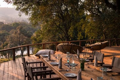 Outside deck at dusk overlooking Mara River