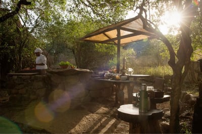 Chef preparing a meal outside at Serian the Original