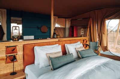 Double bed in the mobile tented camp at Usawa Serengeti