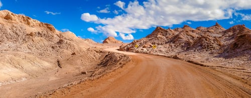 Extreme landscape, dirt road in the moon valley, at San Pedro de Atacama, Chile