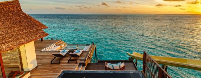  ? Overwater villa in the Maldives at sunset 