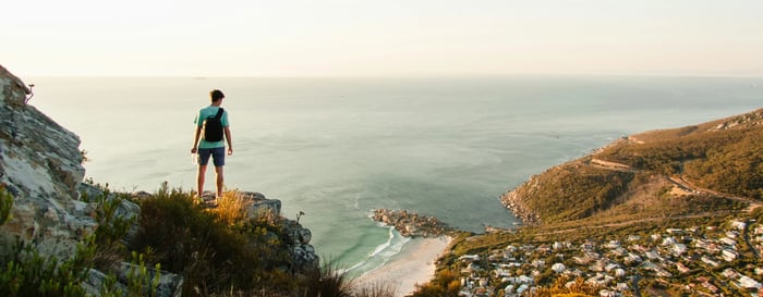 Man standing overlooking bay in South Africa